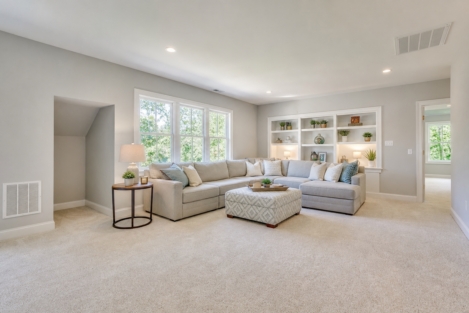 Finished upstairs bonus room with soft neutral carpet and warm natural light
