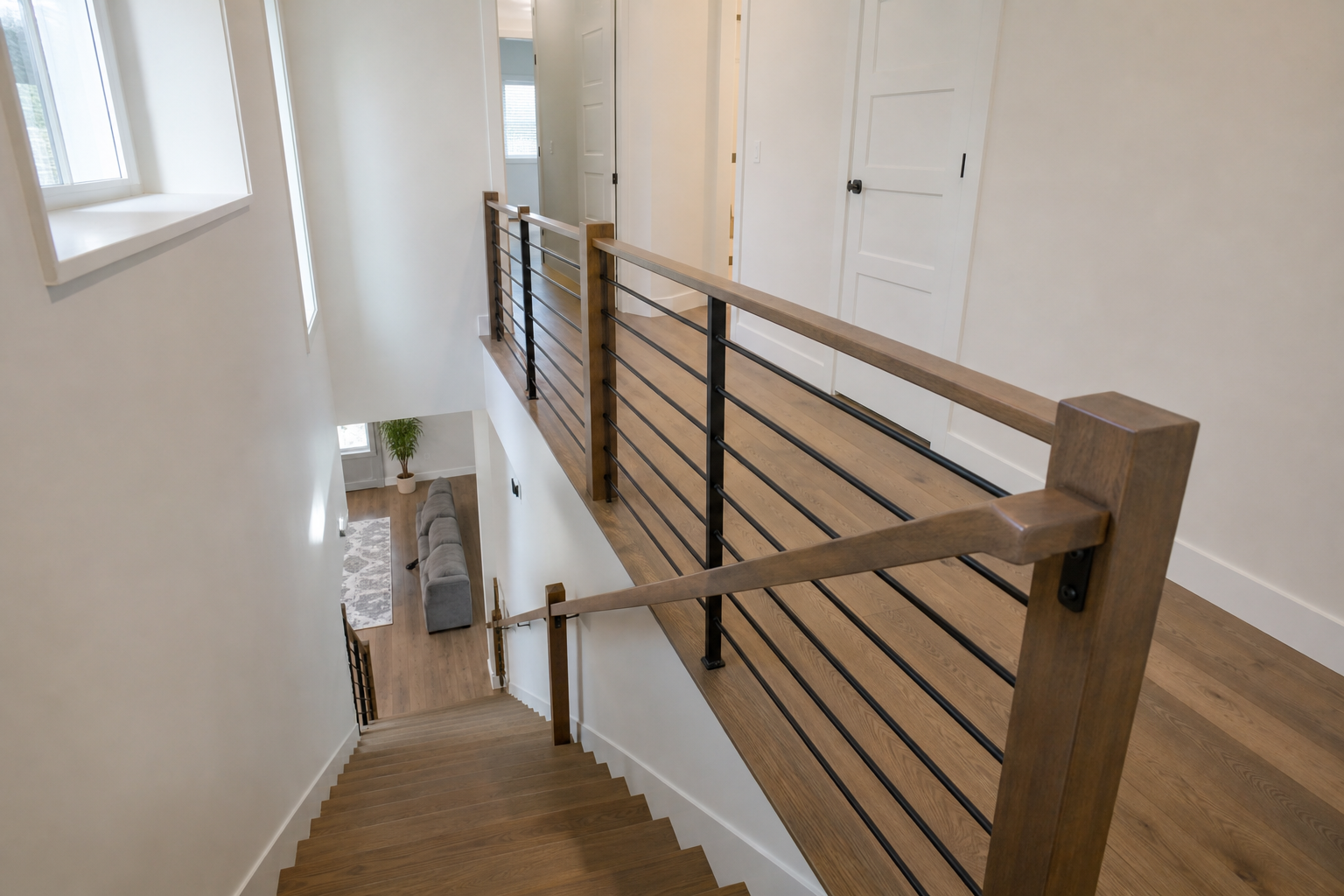 Finished hardwood staircase and hallway with clean transitions in a Bluffdale home