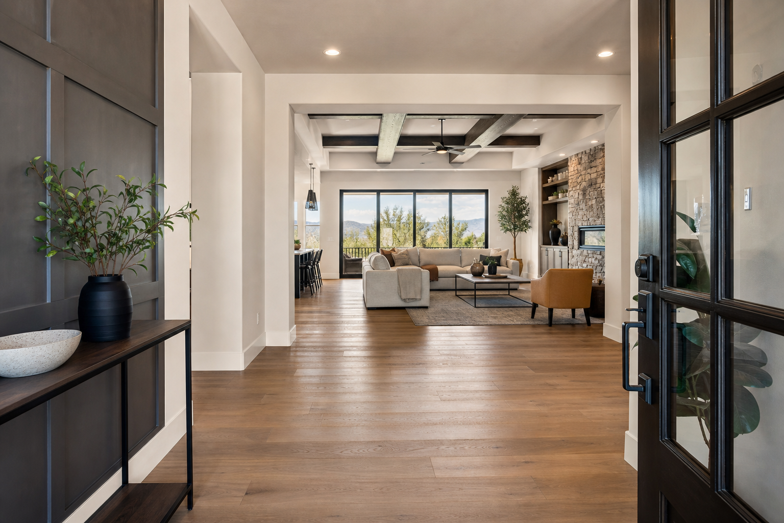 Finished entry and great room transition with warm real wood flooring